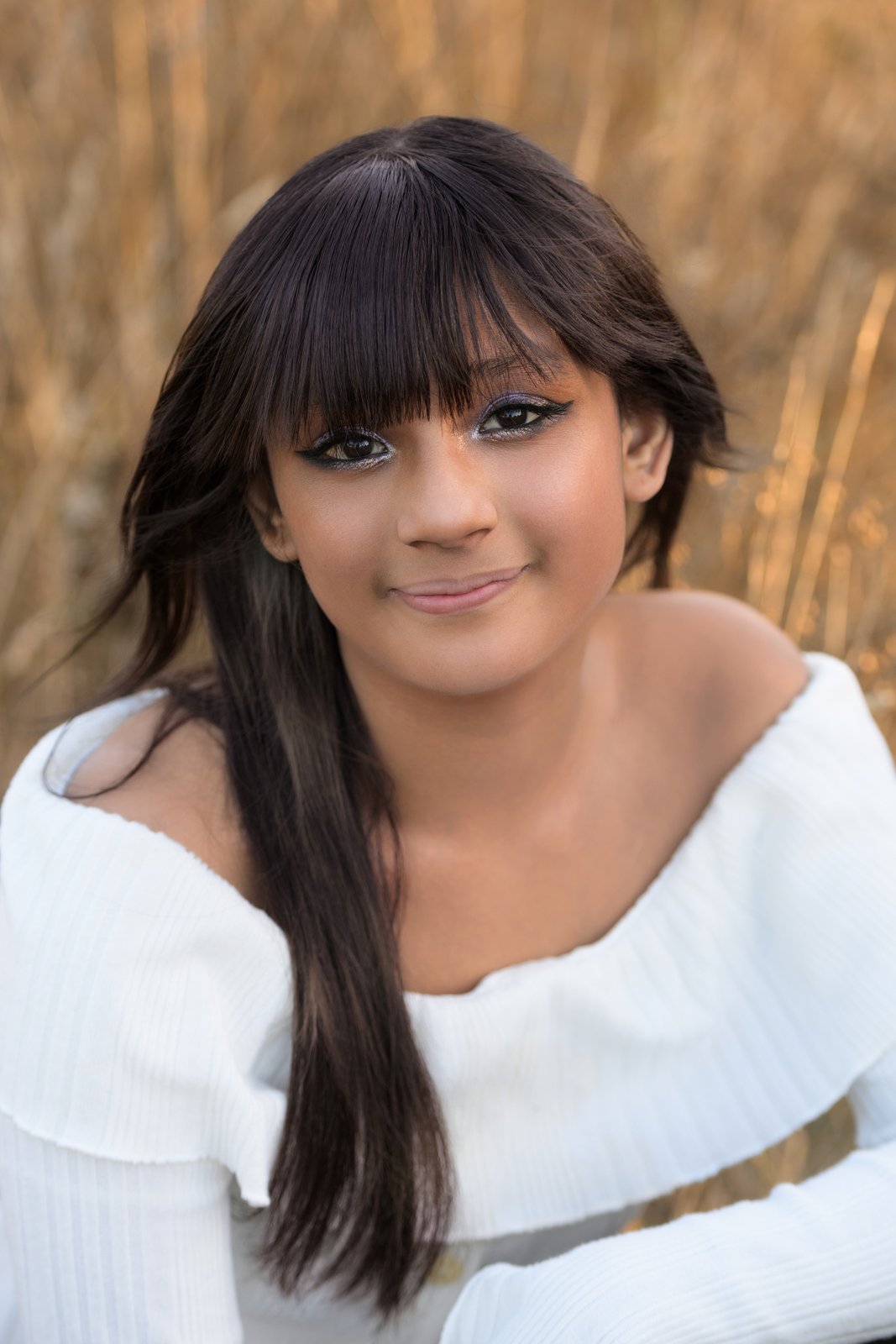 Lu senior portrait, chin resting on hand